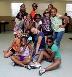 Children posing for photo wearing sunglasses