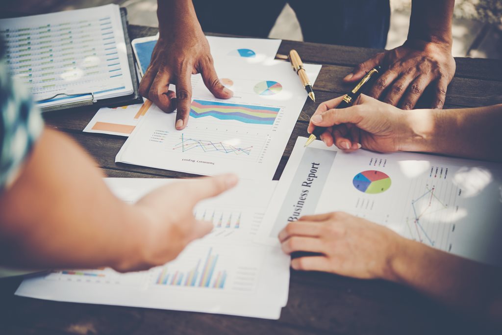 business reports and charts on a table