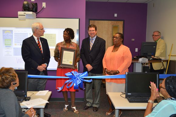 April 17, 2014 photo of Council Member Anderson with Council President Gulliford, Library Board Chair Brenda Simmons-Hutchins and Council Member Lee at the ribbon cutting ceremony to open the e-classroom at Bradham Brooks Branch Library.