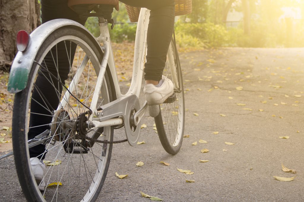 closeup of woman riding bicycle in park