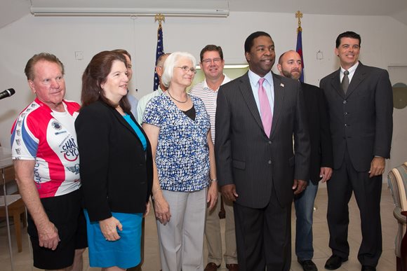 July 27, 2014 photo of Council Vice President Greg Anderson and others at the ceremonial signing of legislation appropriating funding for water lines in the Larsen Neighborhood.