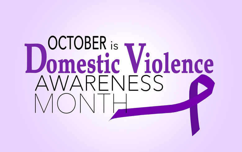 October is Domestic Violence Awareness Month with a purple ribbon