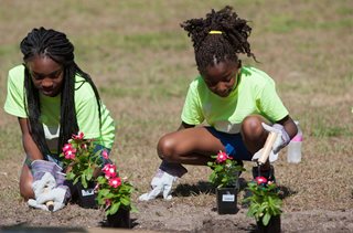 Volunteers helping to beautify Klutho Park at the June 17, 2015 announcement with the U.S. Department of Interior