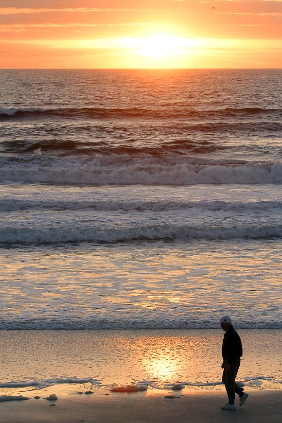 A resident walking along Jacksonville's beautiful coastal waterfront