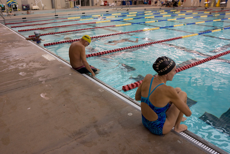 People swimming in public pool