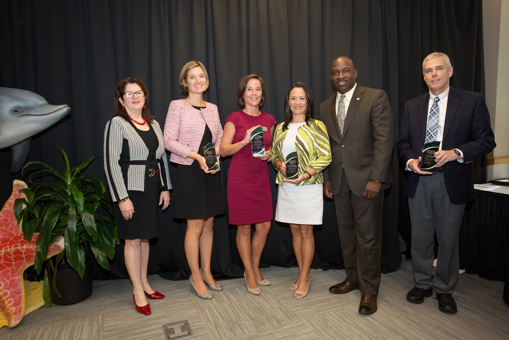 Shown left to right in the photo: Council President Lori Boyer, DCPS Board Member Ashley Smith Juarez, Scenic Jacksonville Board Member Rachel C. Cocciolo, Council Member Anna Brosche, Director of Community Affairs Charles Moreland and DCPS Board Member Sc