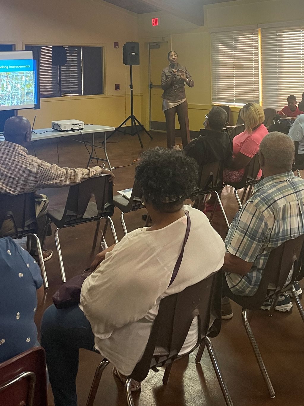 Photo of Council Member Clark-Murray speaking with the residents of the community.