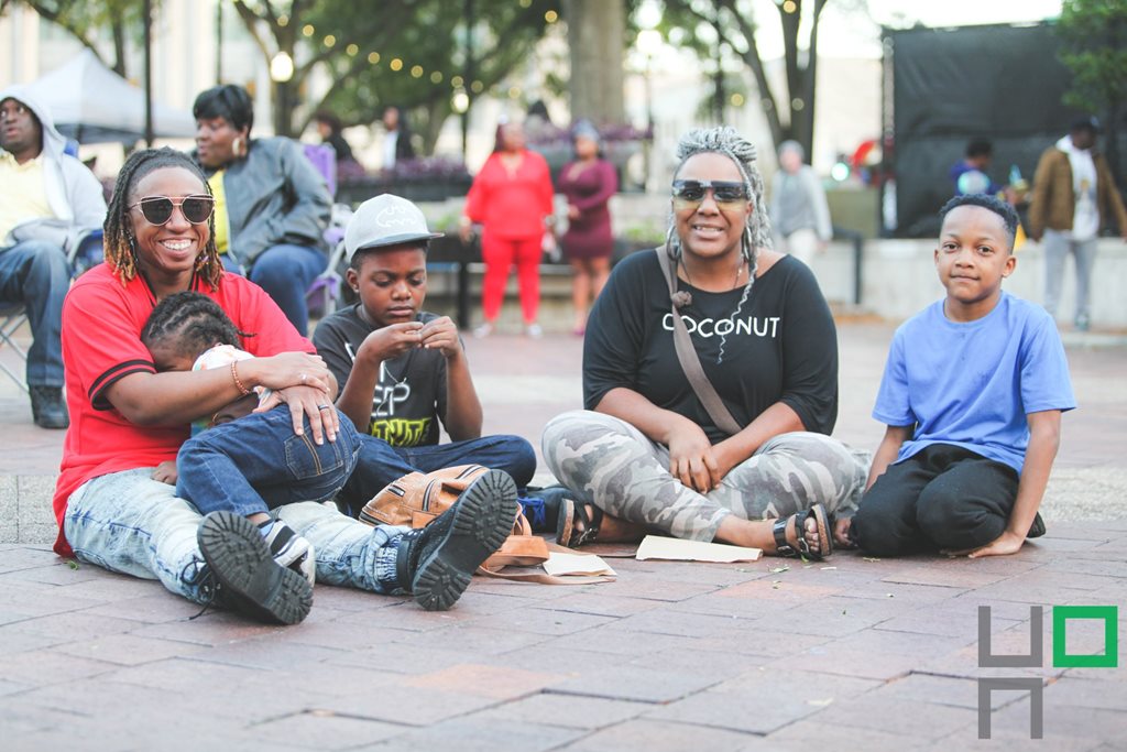 family sitting in hemming park