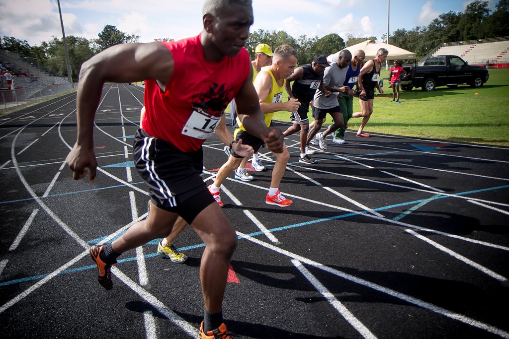 senior men participating in track and field event