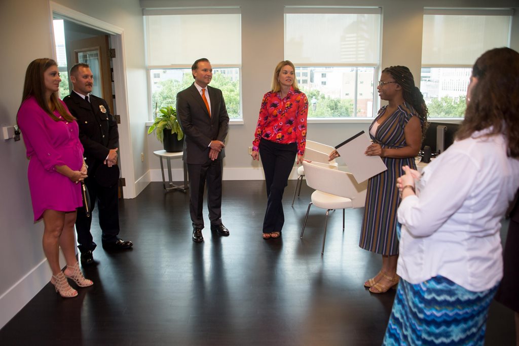 The Mayor and his wife, Molly Curry, talking with City employees before the Sept. 4, 2018 news conference announcing the new parental leave policy for City employees.