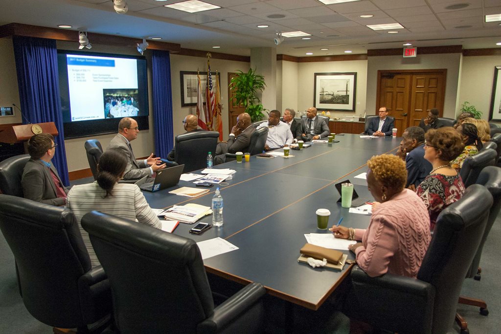 Mayor Lenny Curry and Martin Luther King Jr. Breakfast Host Committee members discuss plans for the 31st annual event.