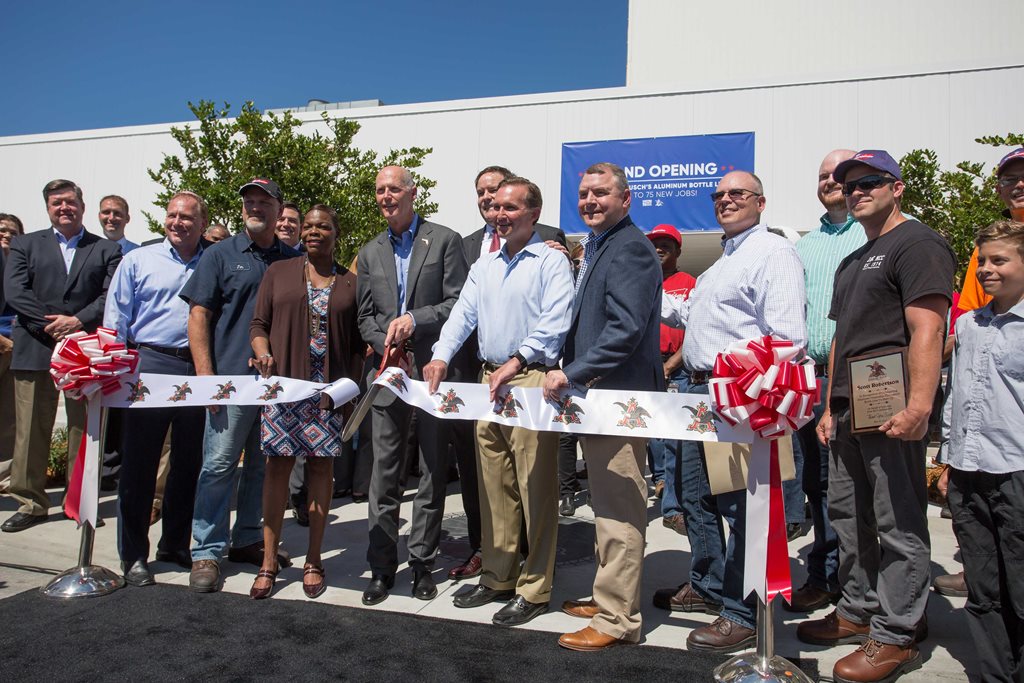 Cutting the ribbon for Metal Container Corporation's expanded facility on May 16, 2017, creating 75 new jobs.