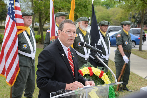 Photo of Council Member Jim Love speaking at the rededication ceremony for the Vietnam War Monument.