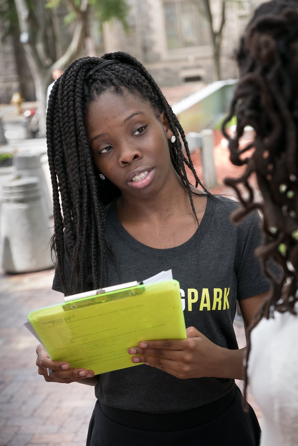 Anecia interviewing a Hemming Park visitor as part of her marketing intern duties with Friends of Hemming Park.