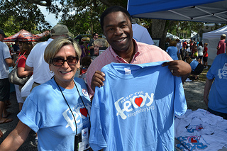 Photo of Mayor Alvin Brown, with St. Johns Ferry Commissioner Elaine Brown, displaying a Save the Ferry T-Shirt.