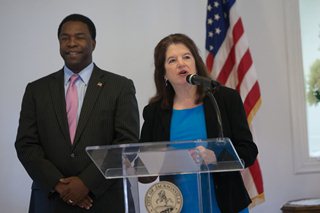 July 26, 2014 photo of the Council Member Lori Boyer addressing the audience as Mayor Alvin Brown looks on.