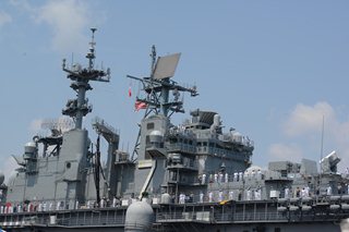 Photo of sailors lining the railing as the USS Iwo Jima docks at Naval Station Mayport.