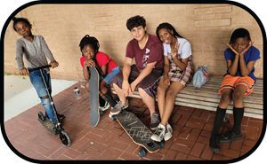 group of high school students sitting on bench