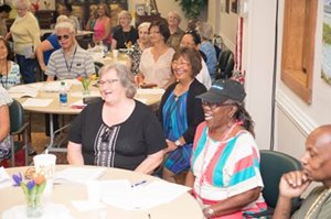 seniors at an event smiling and having a good time