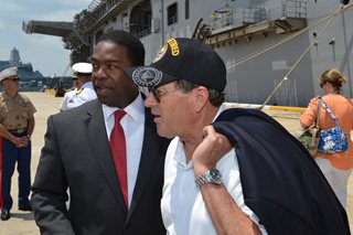 Photo of Council Member Jim Love disemarking from the USS Iwo Jima.