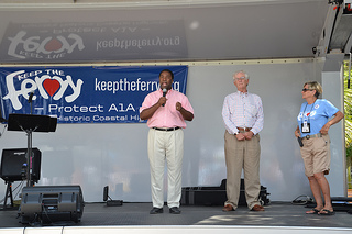 Photo of Mayor Alvin Brown addressing the audience as Council Vice President Bill Gulliford and St. Johns River Ferry Commissioner Elaine Brown look on.